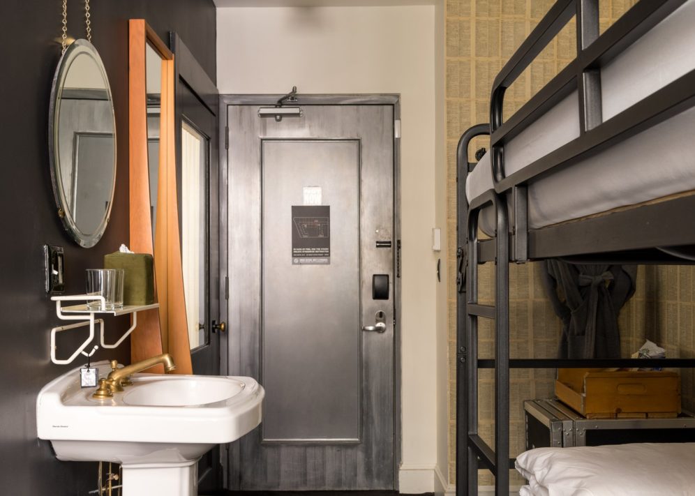 A cozy room features a sink and private toilet area