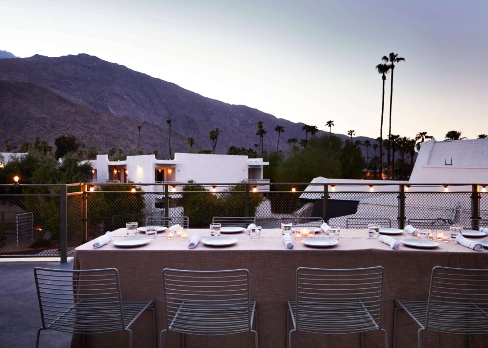 A fully outdoor event venue provides panoramic views and supports configurations for intimate meetings and celebrations